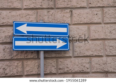 road sign indicating one way in both directions