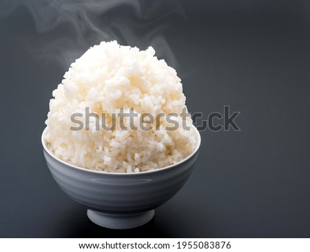 A large serving of rice in a bowl. Royalty-Free Stock Photo #1955083876