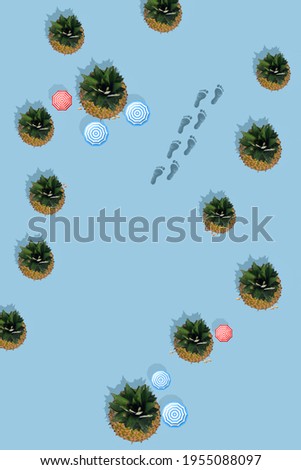 Trendy sunlight Summer pattern made with pineapple fruit on bright light blue background. Minimal summer concept.