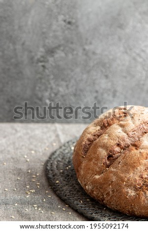 Bread in basket on gray marbled background