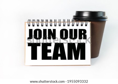 Join our team. text on a yellow sticker attached to a cup of coffee near the calculator. working table. White background