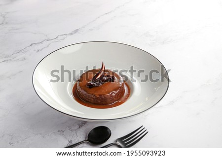 signature sticky dates pudding, Dates cake with sauce, on white background 

