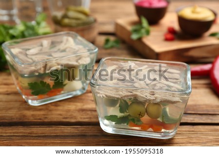 Delicious aspic with meat on wooden table