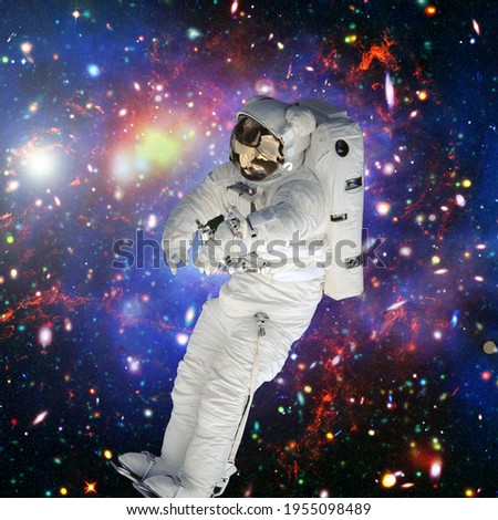 Astronaut surfing dark space. Planets stars. Space scene. The elements of this image furnished by NASA.

