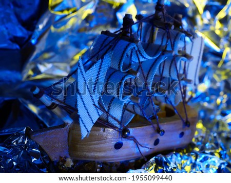 Collectible ship figurine in gold color. art. ship model. Macro.