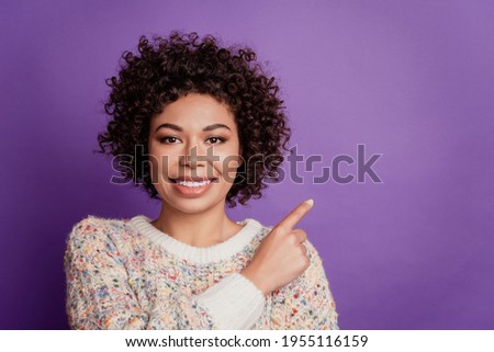 Portrait of young business woman directing forefingers empty space banner sale