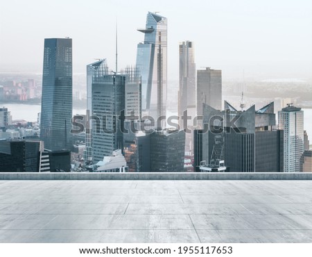 Empty concrete dirty rooftop on the background of a beautiful New York city skyline at sunset, mock up