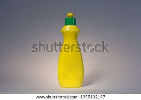 Photo of a jar with a cleaning agent on a solid background.
