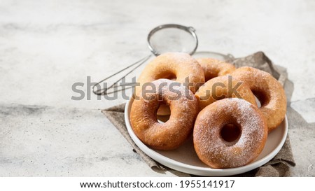 Homemade donuts on grey cement background. Food concept. Copy space. Royalty-Free Stock Photo #1955141917