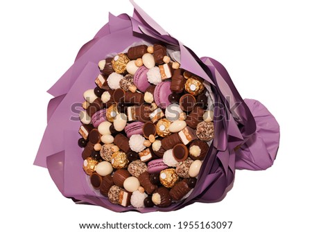 Chocolate Sweet candy bouquet isolated on white background. Assortment of chocolate colourful, festive sweets candy lilac macaroons and nuts. Birthday, Mother's Day, Women Day, Valentine's Day concept