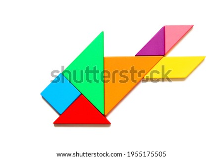 Color tangram puzzle in fish shape on white background
