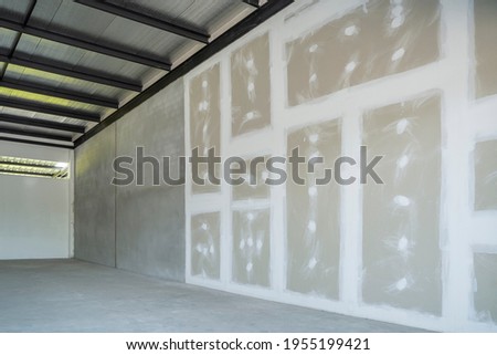 Drywall for gypsum walls structure and plaster mortar in decorate interior room in building construction site, remodeling, renovation and reconstruction.
