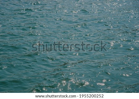 Surface of sparkle blue sea. Royalty-Free Stock Photo #1955200252