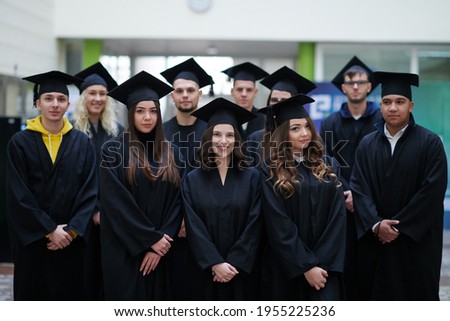 Group of diverse international graduating students celebrating