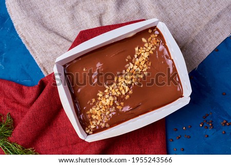 chocolate with nuts in a cardboard box
