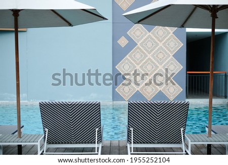 Empty Sun beds beside the pool