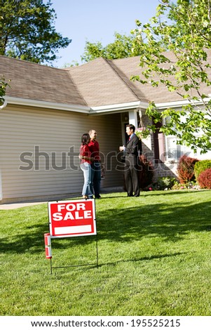Home: Real Estate Agent Talks With Buyers