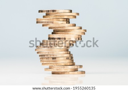Inconsistency or unstable heap of coins could crash down any time, risk investment, uncertain financial status concept Royalty-Free Stock Photo #1955260135
