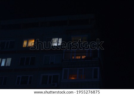 
a picture of a house, with the lights inside an appartements