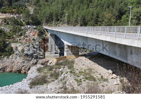 New road bridge in the upper reaches of the reservoir on the Dim River, April 2021