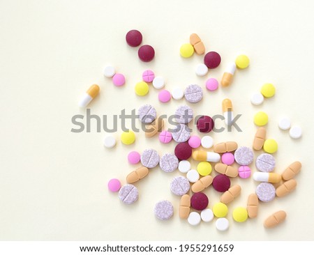 Pills and capsules background stock photo.