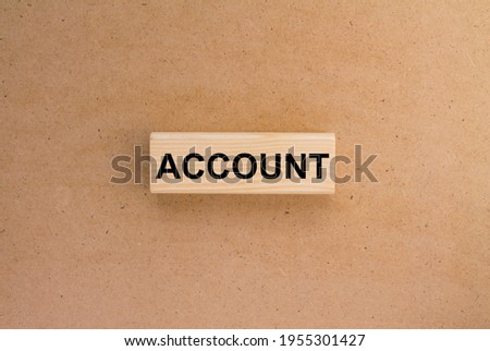 Wooden blocks with text Account on the cardboard background. Concept photo