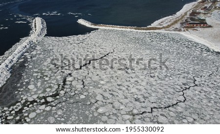 frozen winter harbour ocean ice formation Royalty-Free Stock Photo #1955330092