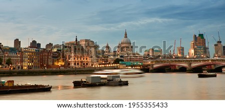 London, United Kingdom. Panoramic aerial view over Thames river with St. Paul Cathedral, skyscapers of City and London skyline. Toned image.