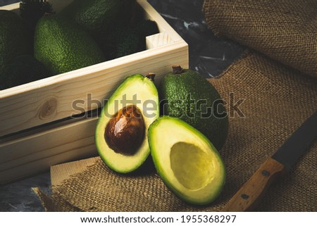 avocado with still life oil fresh vegetables Royalty-Free Stock Photo #1955368297