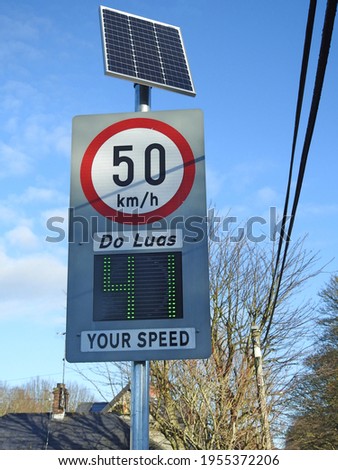 County Louth, Ireland, 6th December 2020. 50 kilometers an hour speed sign and neonspeed indicator on the way into Termonfeckin village. Do Luas is Irish for Your Speed.  Royalty-Free Stock Photo #1955372206