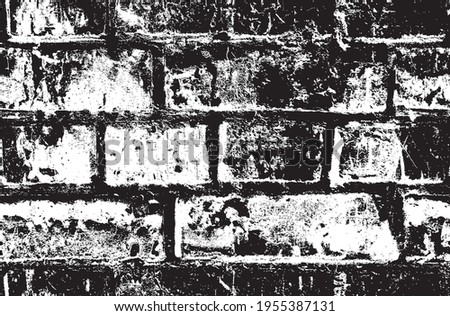 Seamless pattern with black and white brick wall. Vector texture in the grunge style suitable for wallpaper, wrapping paper, fabric. Abstract repeating background with shabby brickwork
