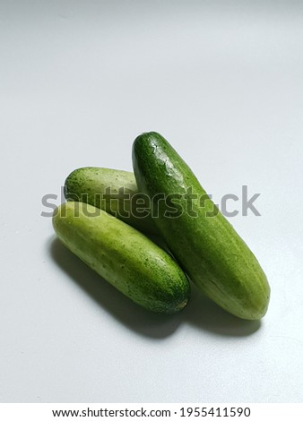 Stacks of Cucumber in selective focus is one of the most commonly consumed vegetables. These vegetables are delicious to be processed and mixed with various types of dishes.  On white background