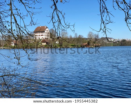 Castle Mauensee (Schloss Mauensee) on a small lake island in a Lake Mauen (Mauesee) - Canton of Lucerne, Switzerland (Schweiz)