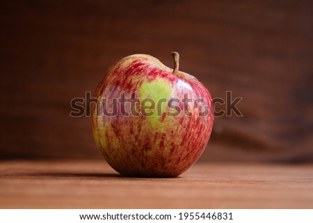 Red apple isolated with wooden background