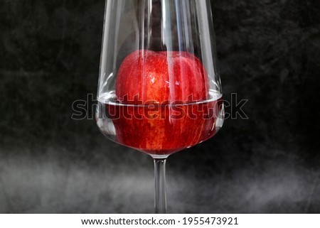 Apple served in glass  of water