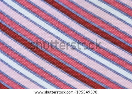 Fabric pink striped texture. Clothes background. Close up