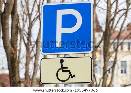 road sign parking space for disabled people. man in a wheelchair. High quality photo