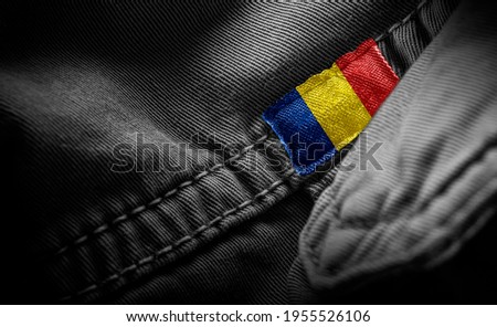Tag on dark clothing in the form of the flag of the Romania