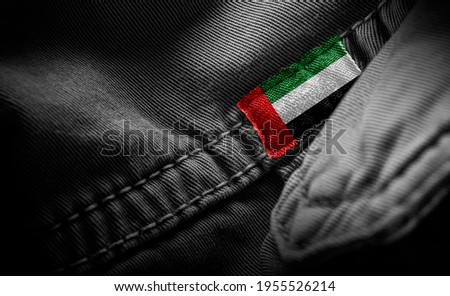 Tag on dark clothing in the form of the flag of the United Arab Emirates