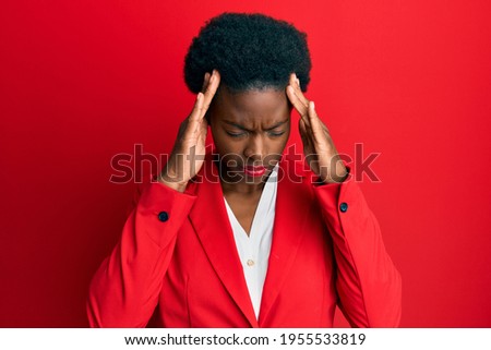 Young african american girl wearing business clothes with hand on head for pain in head because stress. suffering migraine. 