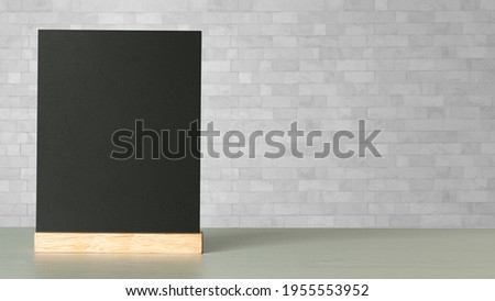 Blank menu blackboard on wooden table on white, copy space,write your message here.education and business concept