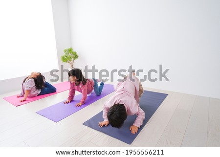 Children doing yoga at home