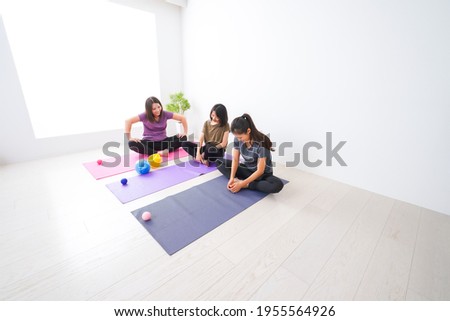 Women doing yoga at home