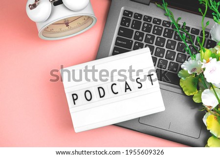 Morning podcast background, flat lay concept of broadcasting, pink paper background and lightbox with text, top view
