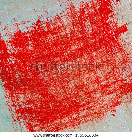 abstract creative background: red blurred stains of colored primer when toning the canvas, temporary object. 