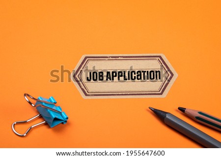 Job Application. Orange document folder and office supplies.