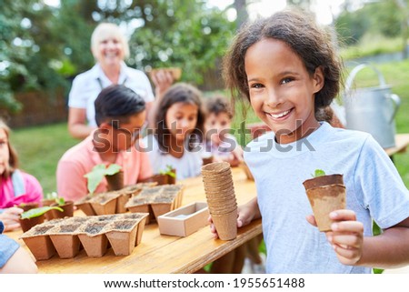 Children learn about sowing and propagating plants in the nursery or at the holiday camp