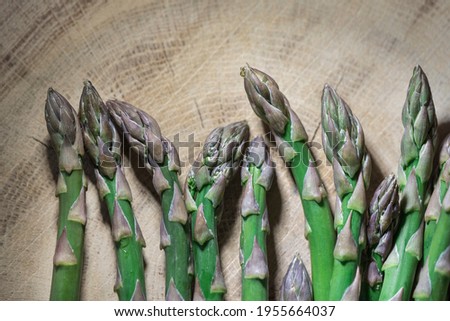 Organic asparagus vegetables on a  wooden  background, close up,  above vantage point photography