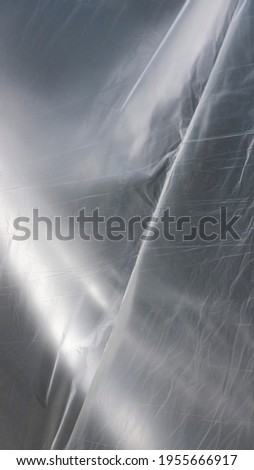 Transparent plastic foil shiny surface drapery
