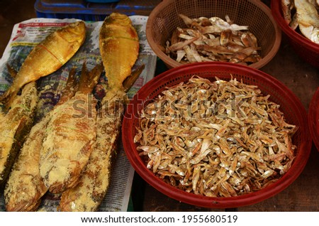 There are some dried hilsa fish and some small marine dried fish for sale